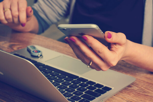 woman holding an iPhone