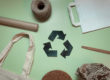 Layout of recyclable things on a green background ecology concern for recycling recycling sign