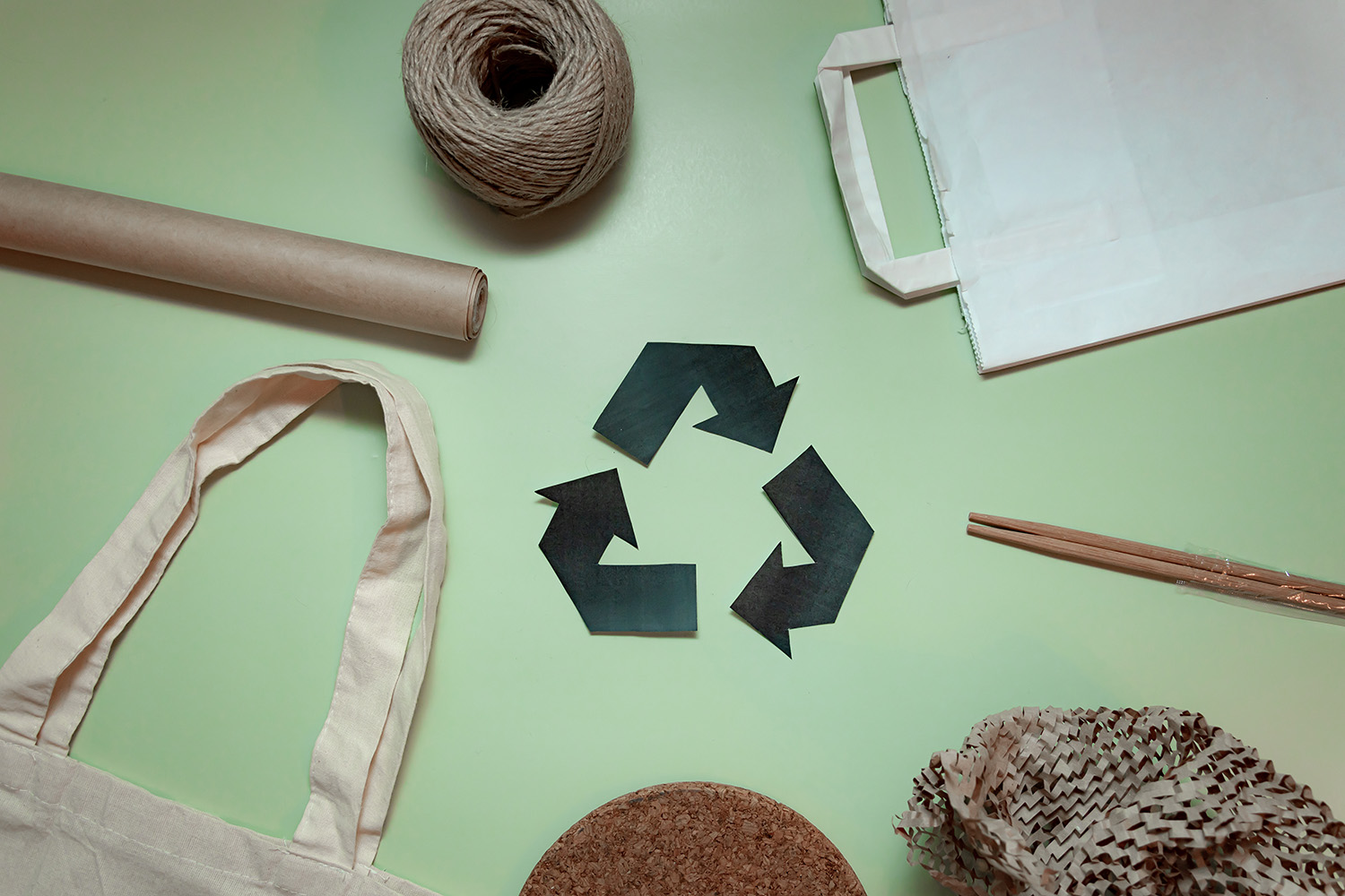 Layout of recyclable things on a green background ecology concern for recycling recycling sign