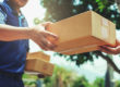 delivery man handing parcel to customer