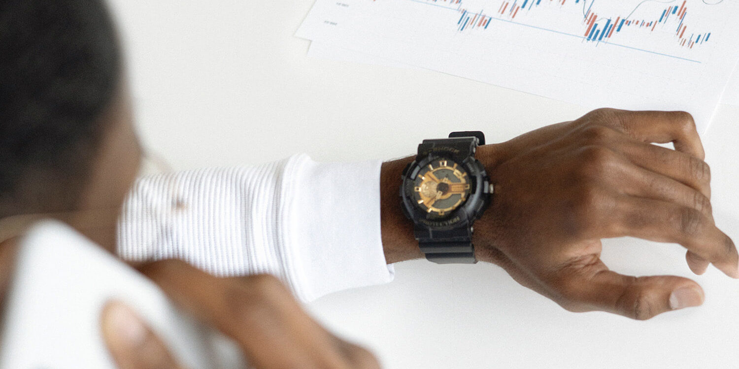 man looking at watch