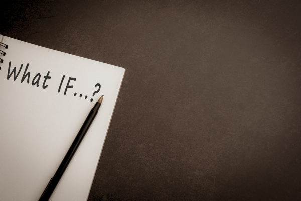 What if question on notepad with dark background