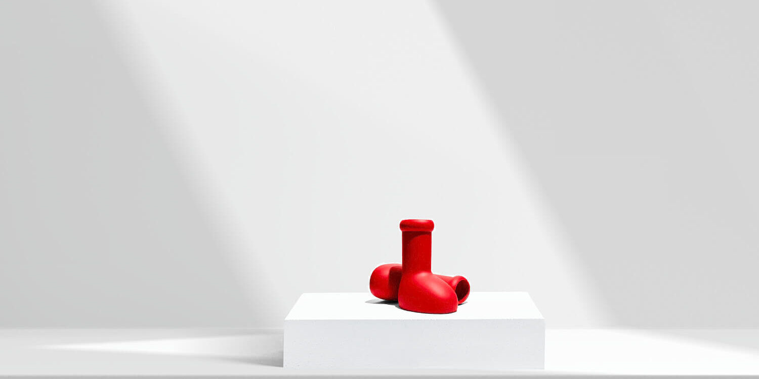 Red boots sitting under a spotlight