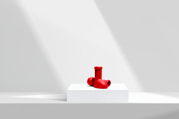 Red boots sitting under a spotlight