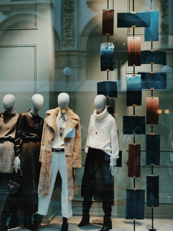 mannequins in luxury retail store window